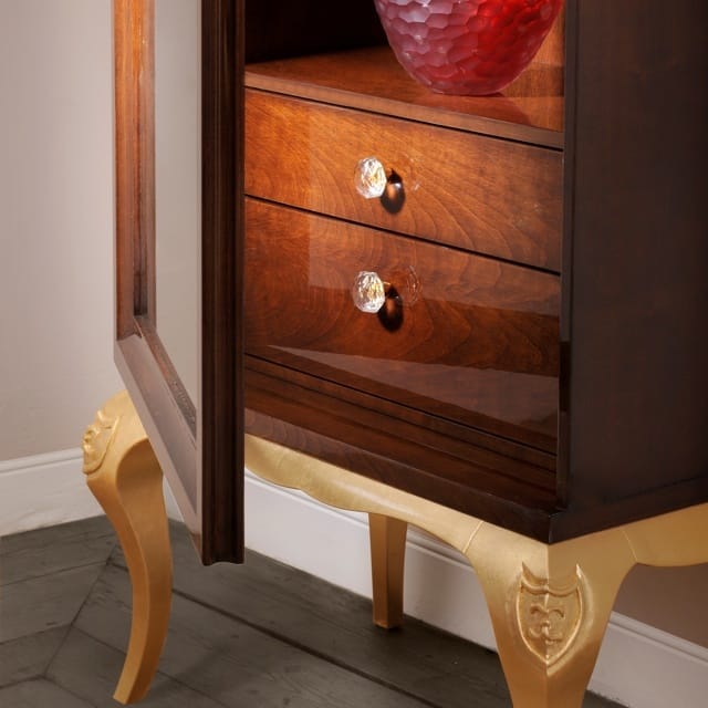 Brown Display Cabinet with Glass Shelves and Gold Accents